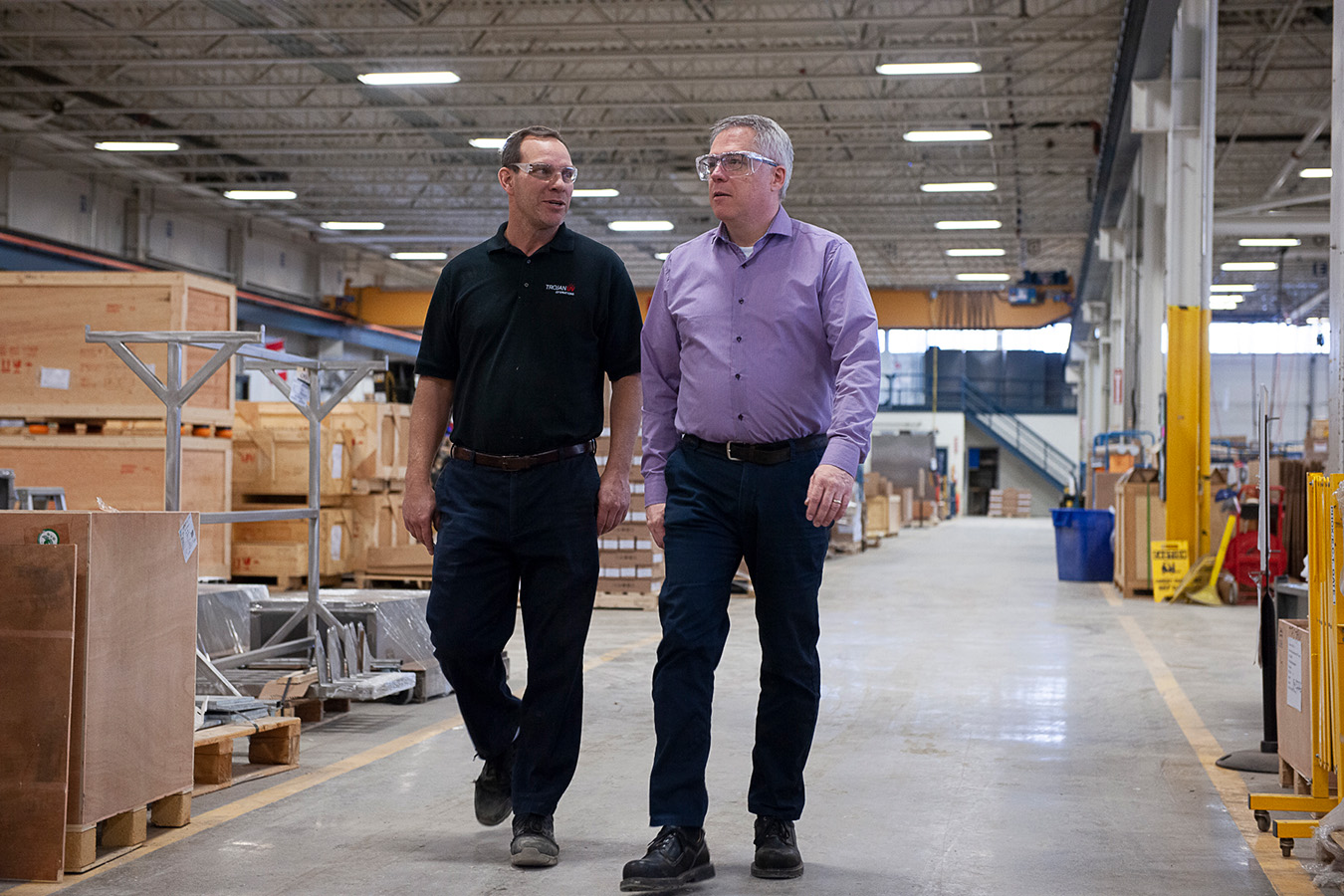 Fanshawe alumni walking through a warehouse