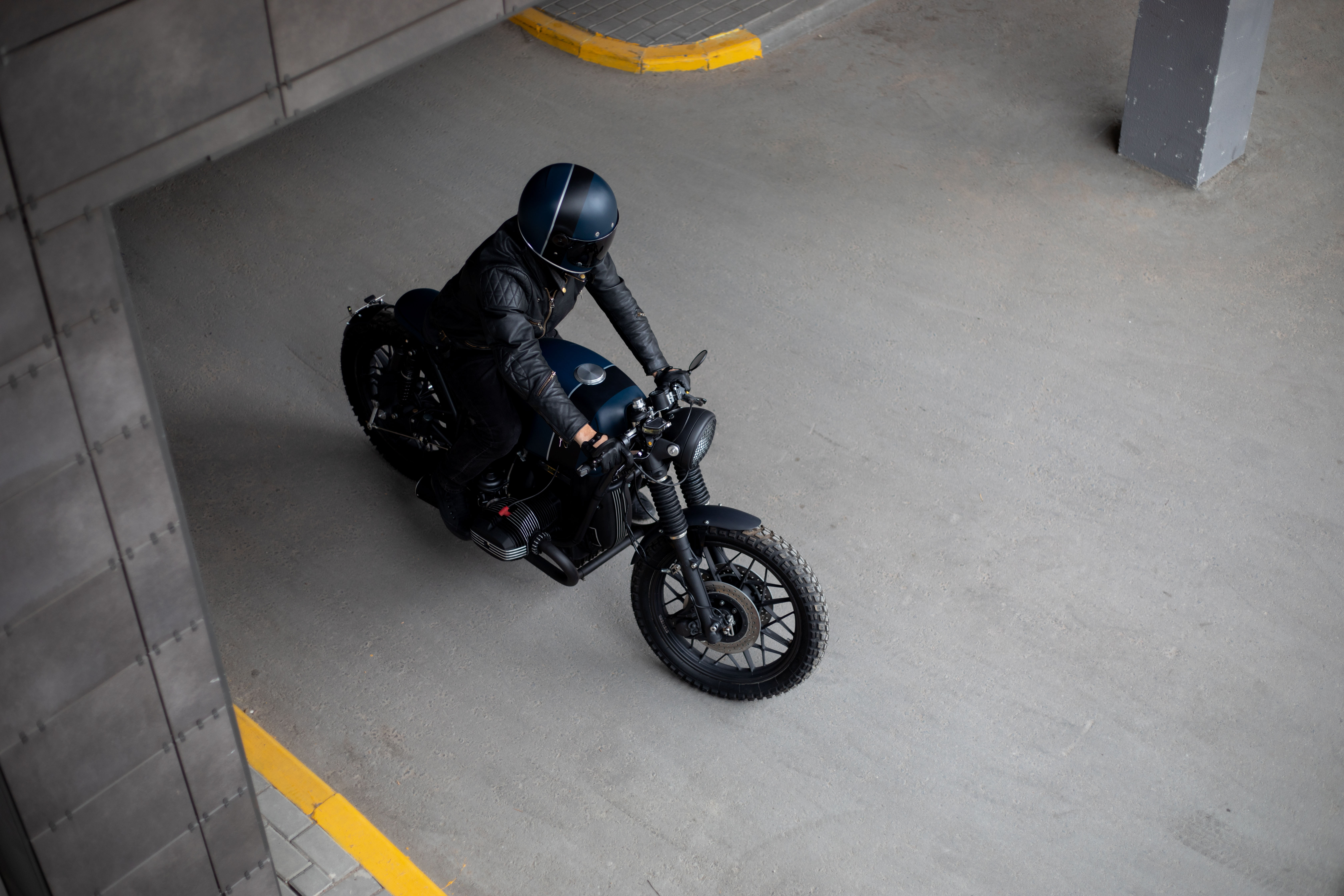 motorcycle driving through a parking garage