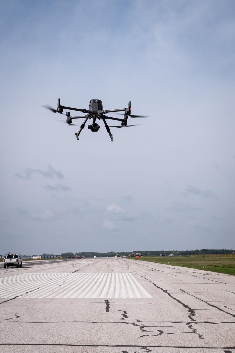 A drone flying over the runway