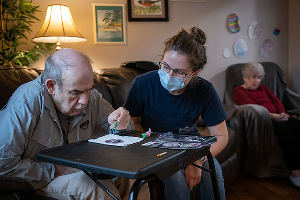 Developmental Services Worker participates in activity with elderly patient