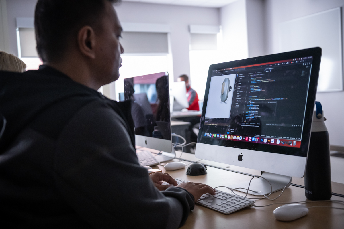 Interactive Media Design student learning in computer lab