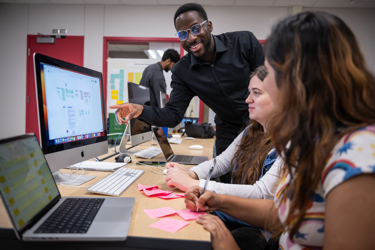 Faculty teaching students about user experience design