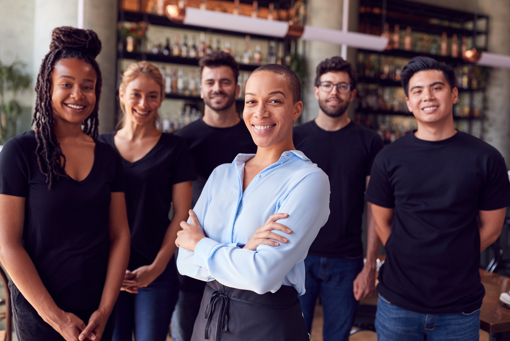 Photo of a bar manager and their staff