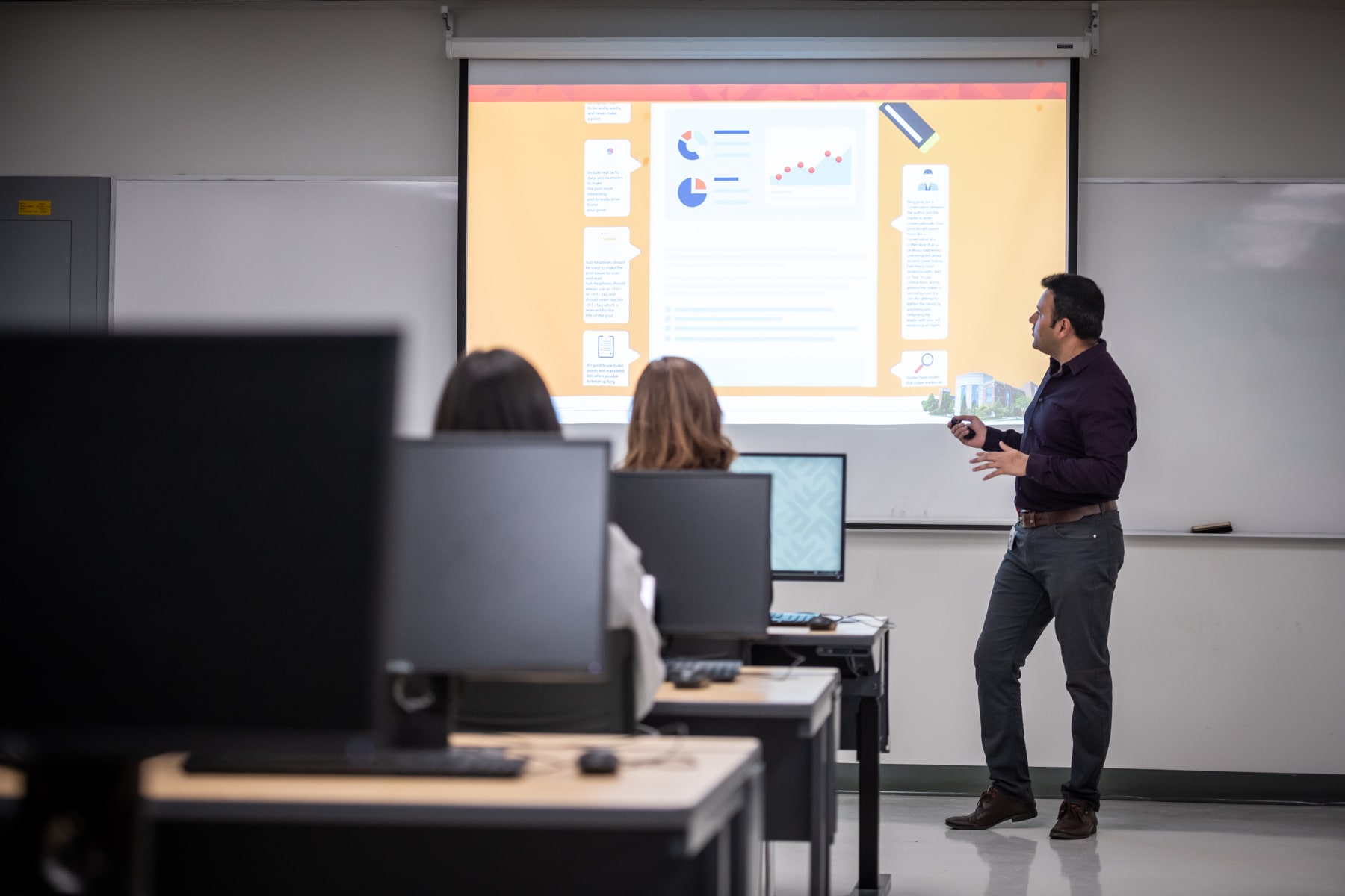 professor uses projector to teach class