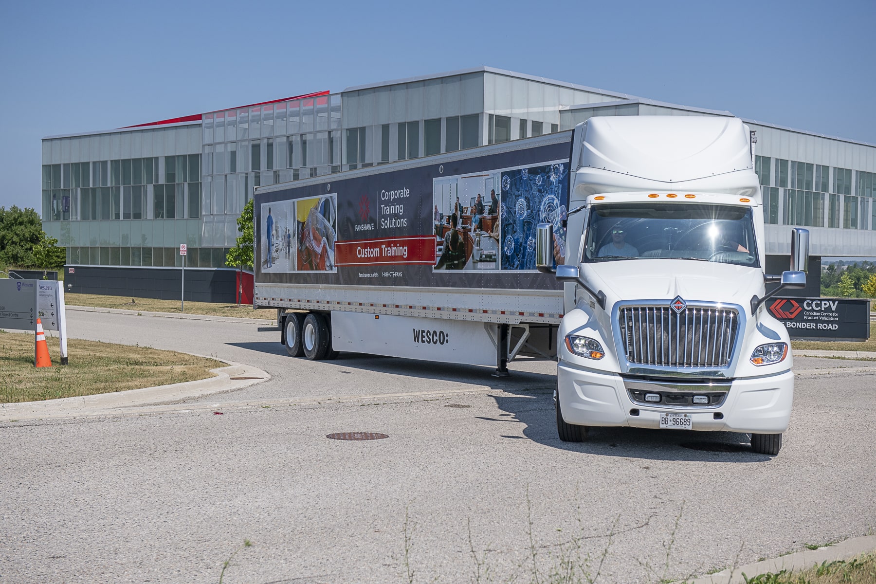 transport truck turning out of lot