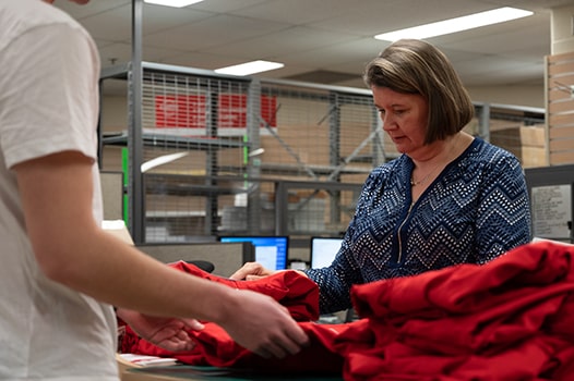 Store shelf stockers, clerks and order fillers person scans products in store