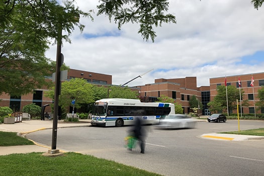 Public Transit Operators bus pulls up at Fanshawe bus stop