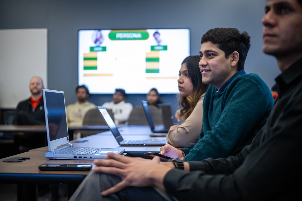 students in classroom watching presentation