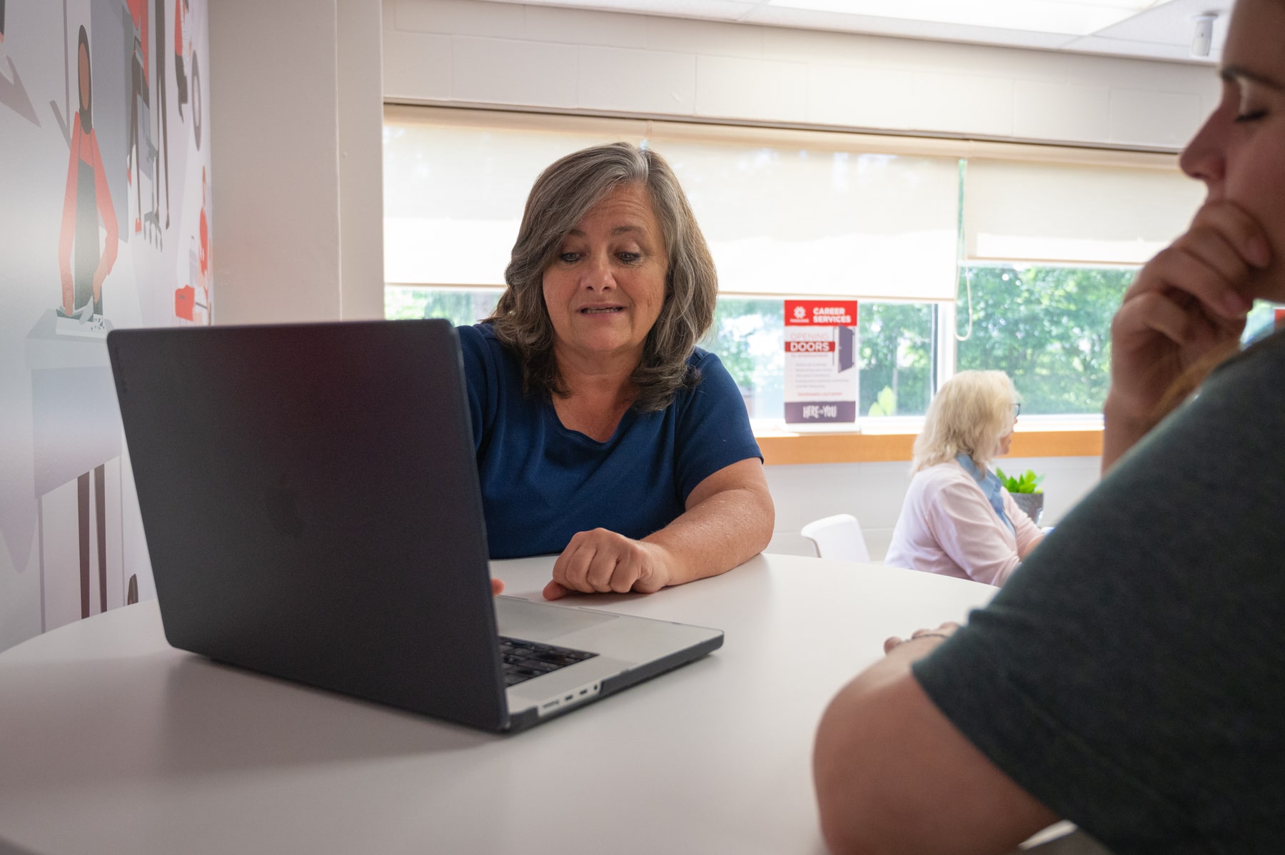 woman in co-op advisory meeting on laptop