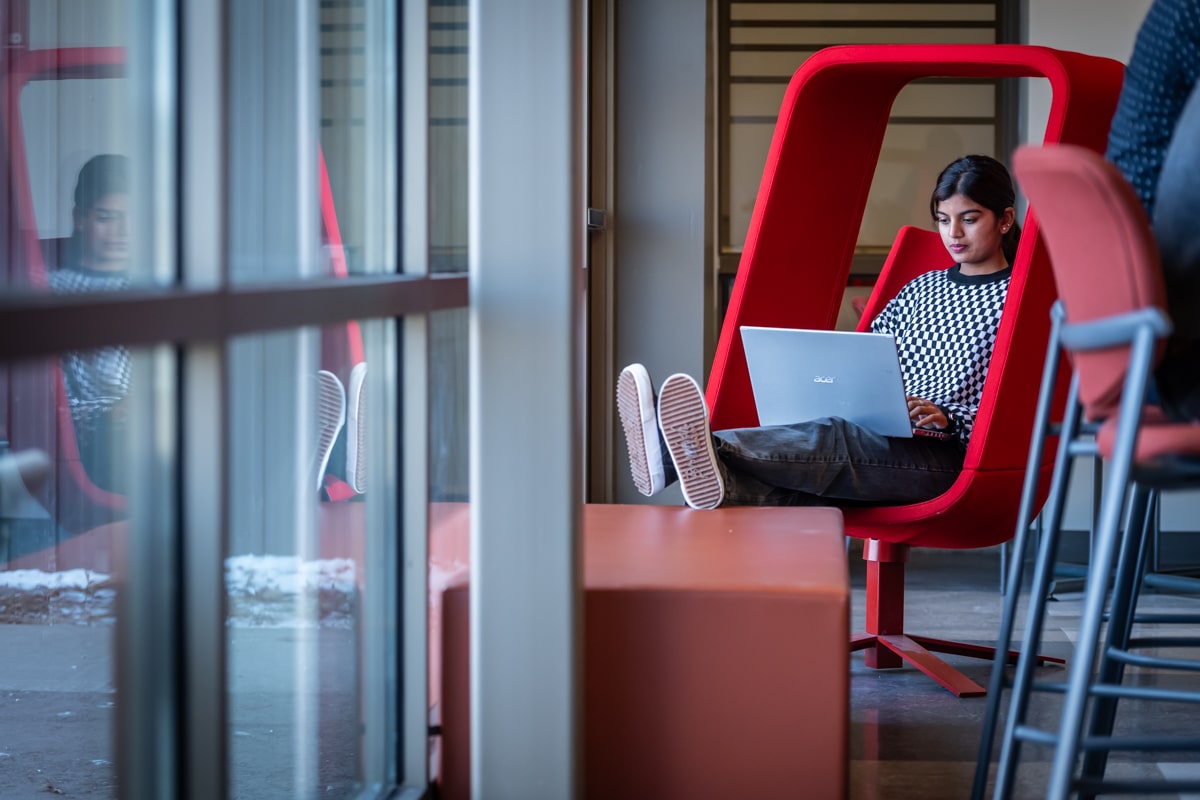 a student is using her laptop