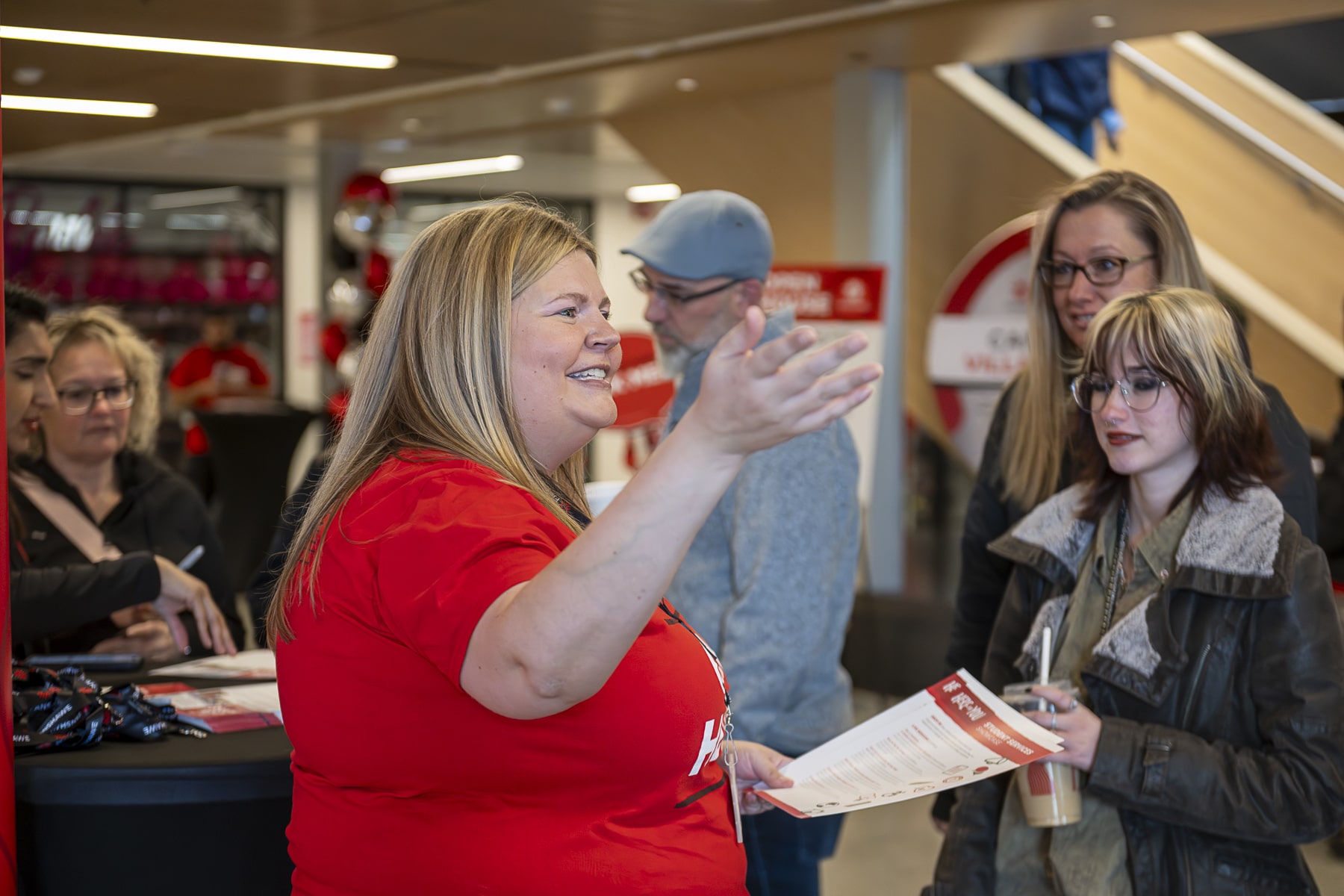 Fanshawe staff is giving an instruction to the new students at the Open House