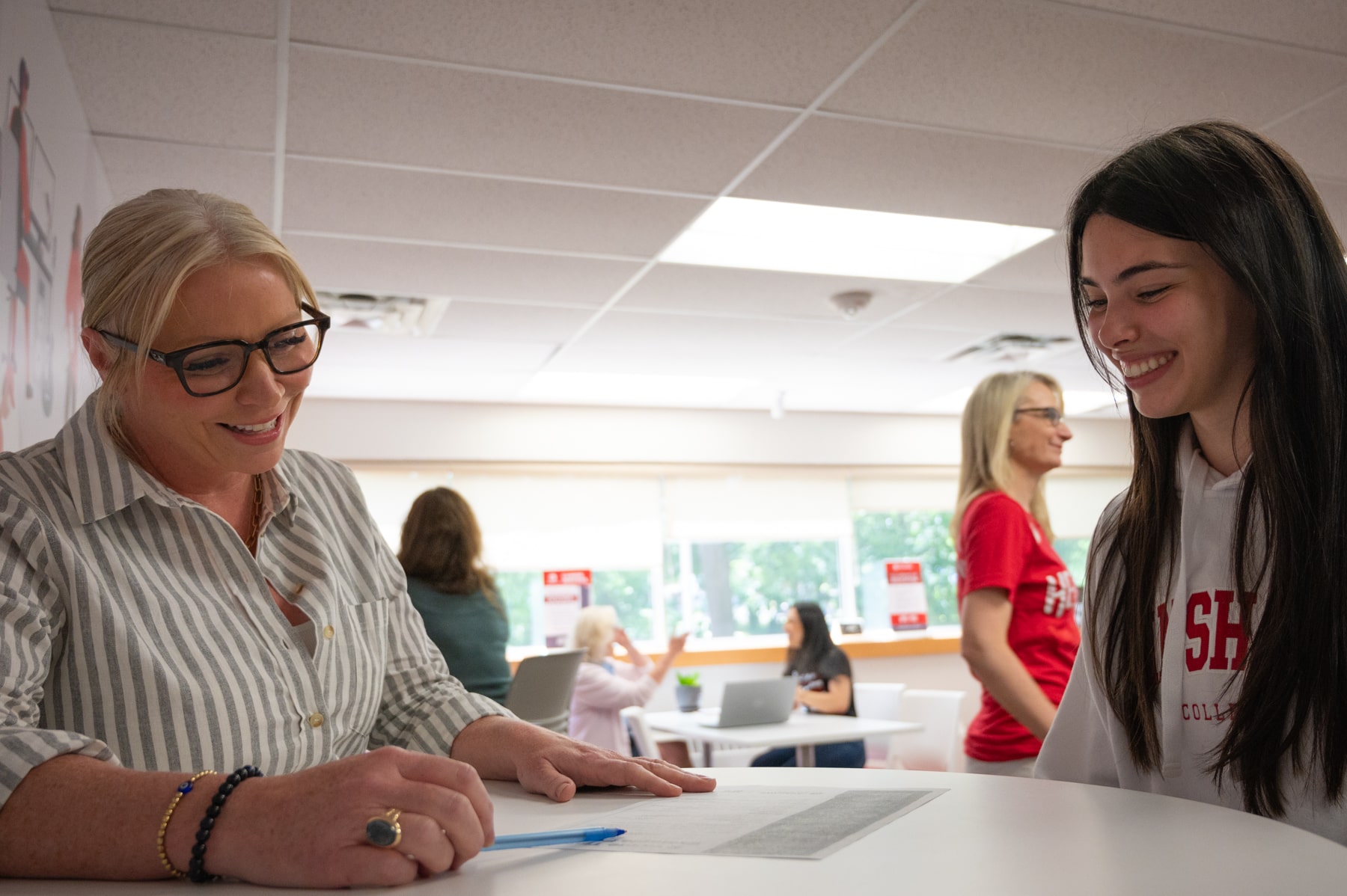 A teacher is talking with a student