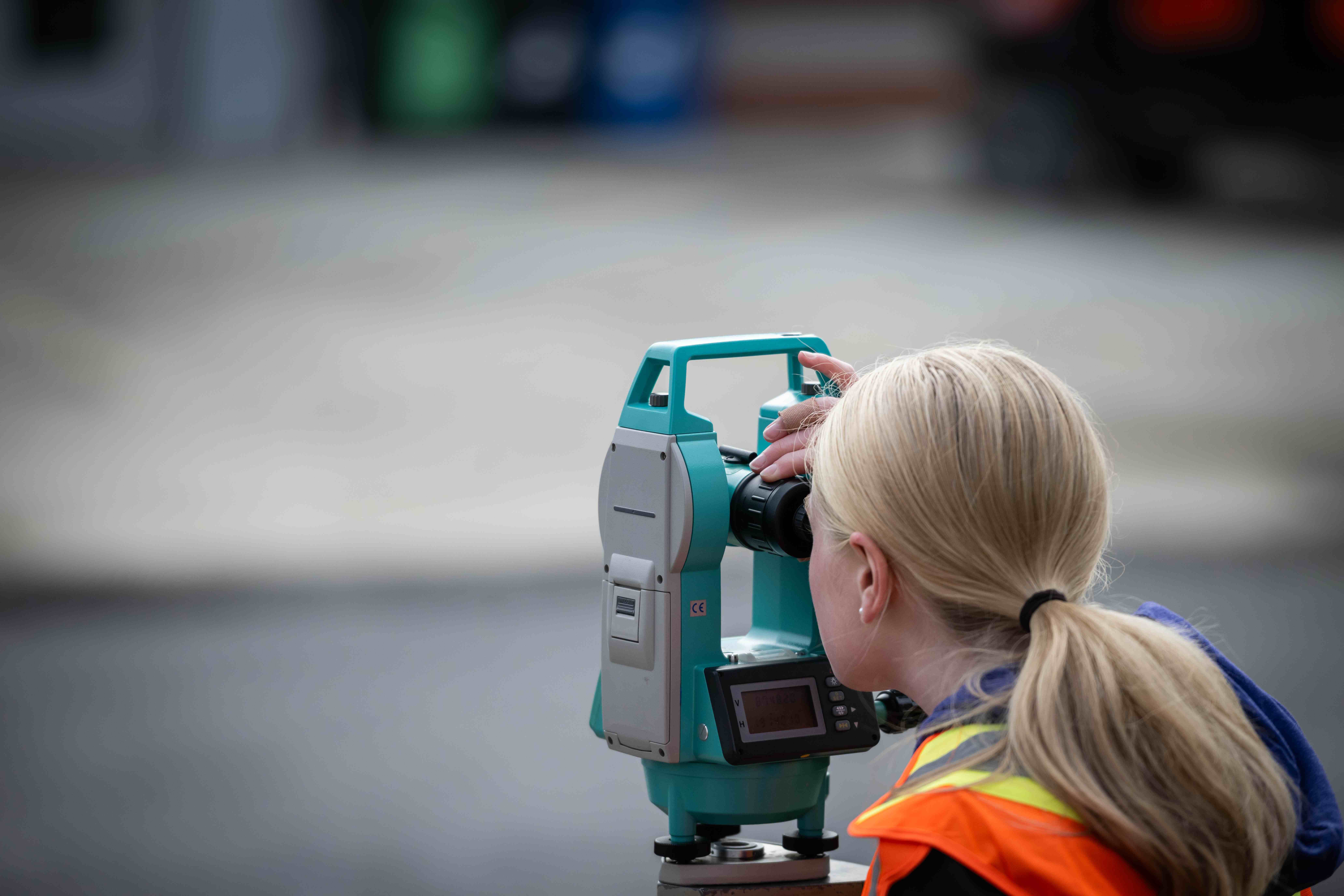 Fanshawe student using an optical level kit