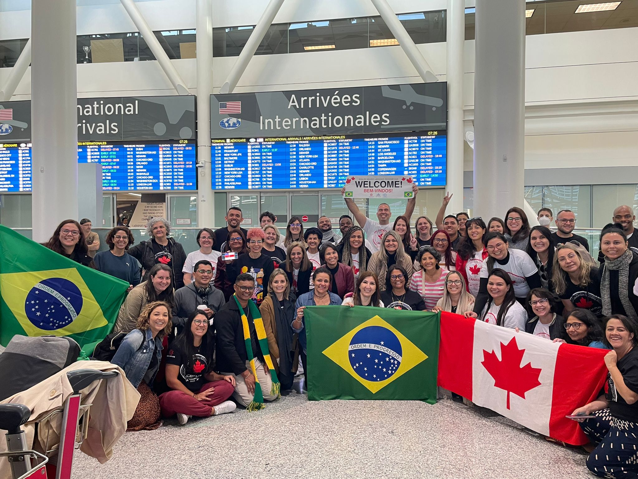 100 teachers from Brazil at the airport