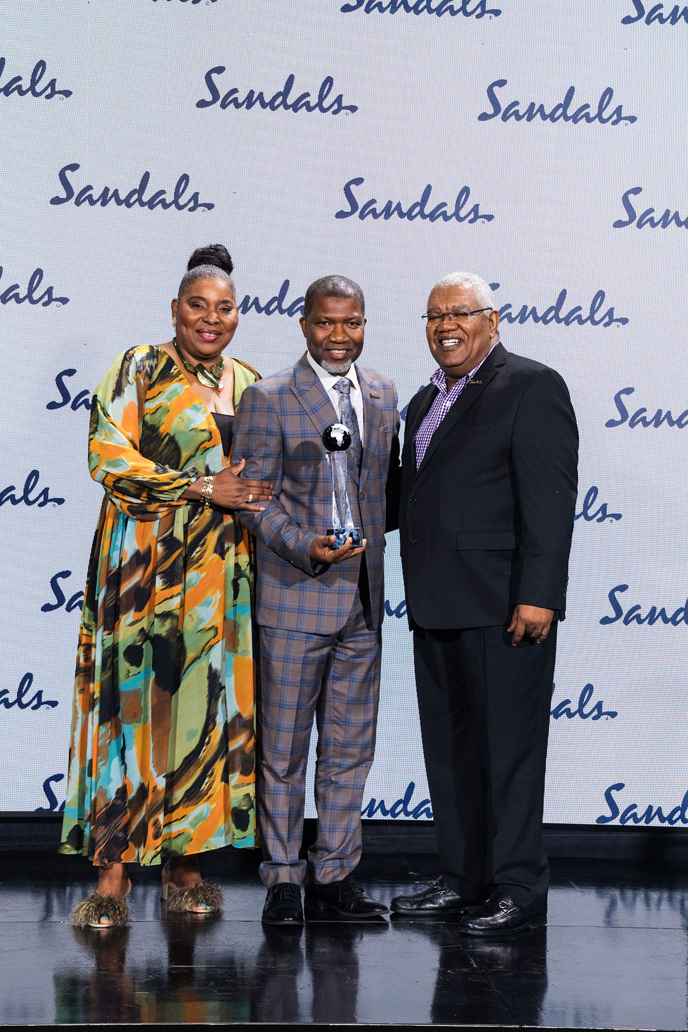 Maureen Barnes-Smith and Gary Sadler present Richard Todd with his award