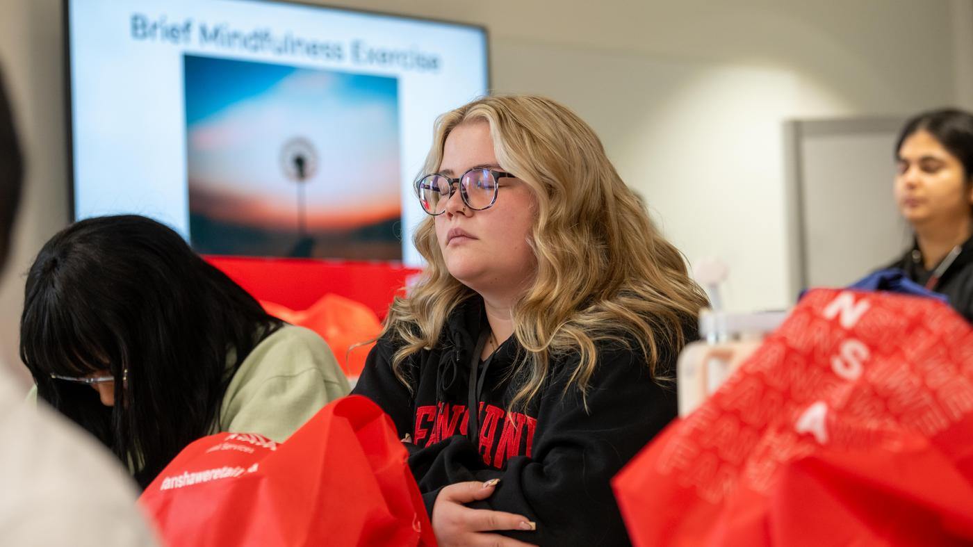 student practices mindfullness at Self Care Conference