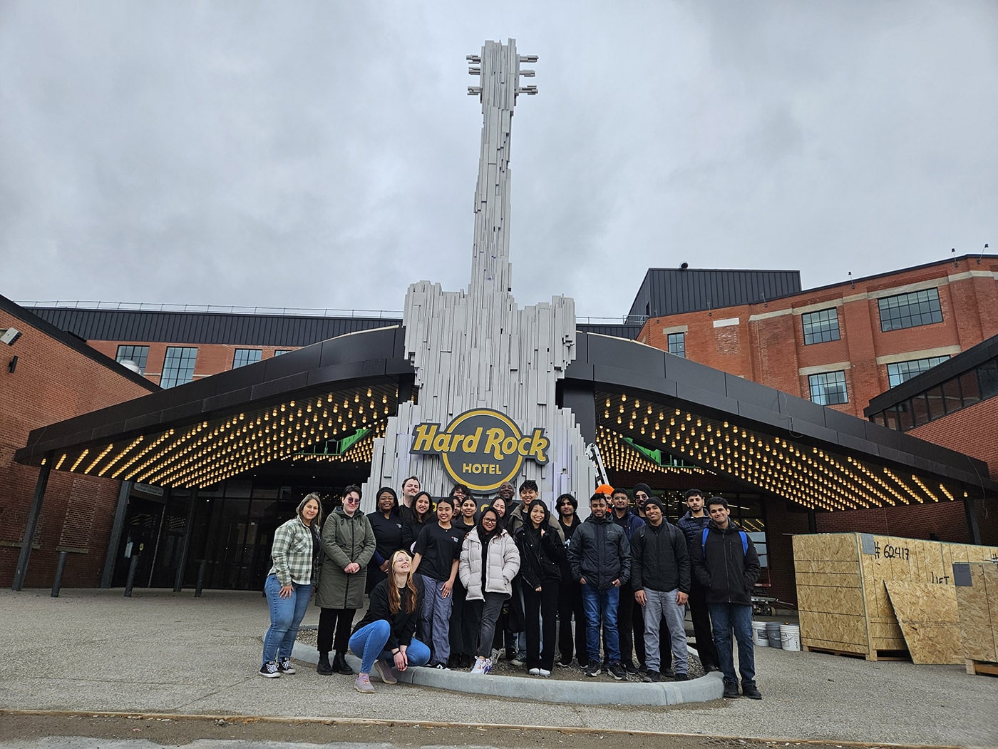 Fanshawe students stand in front of Hard Rock Hotel London Ontario
