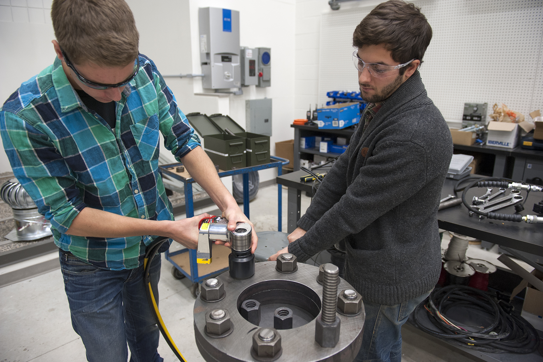 People Working on Wind Tourbine Part