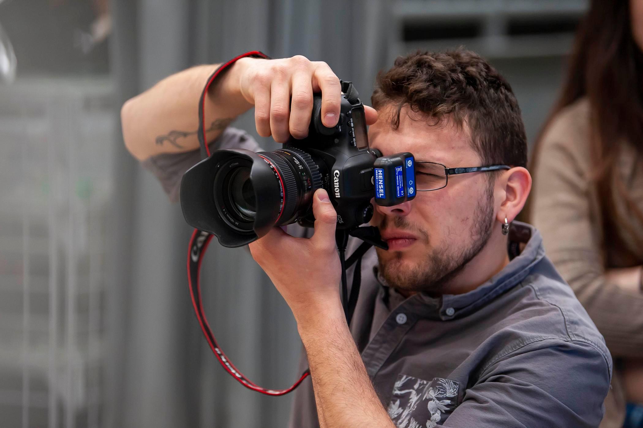 Up close photo of a person using a digital camera