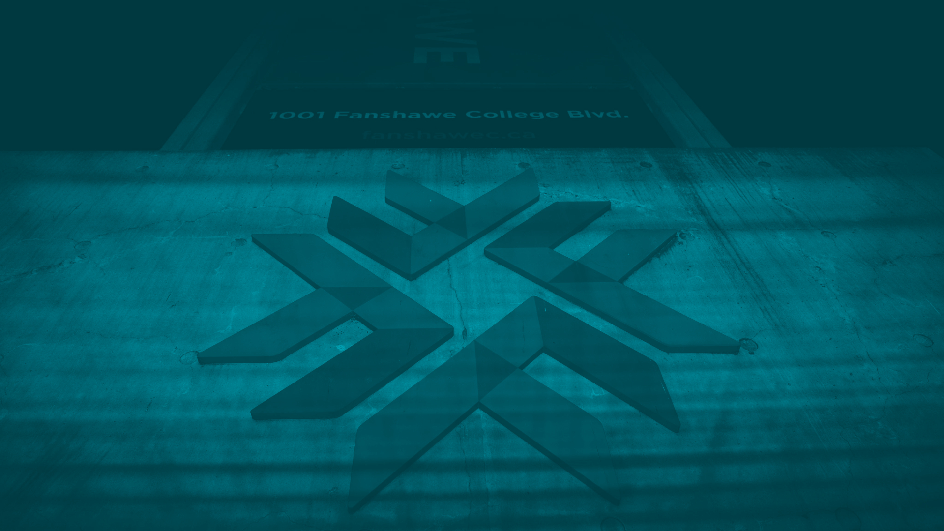 Fanshawe entrance lit teal