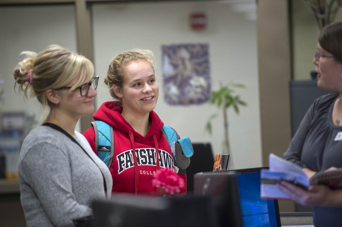 Fanshawe student being serviced by the financial aid staff