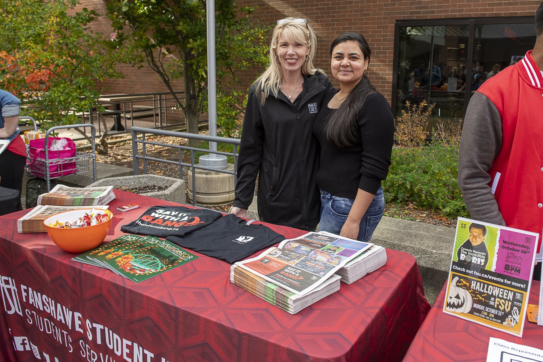Fanshawe Student Union employees posing in front of their booth