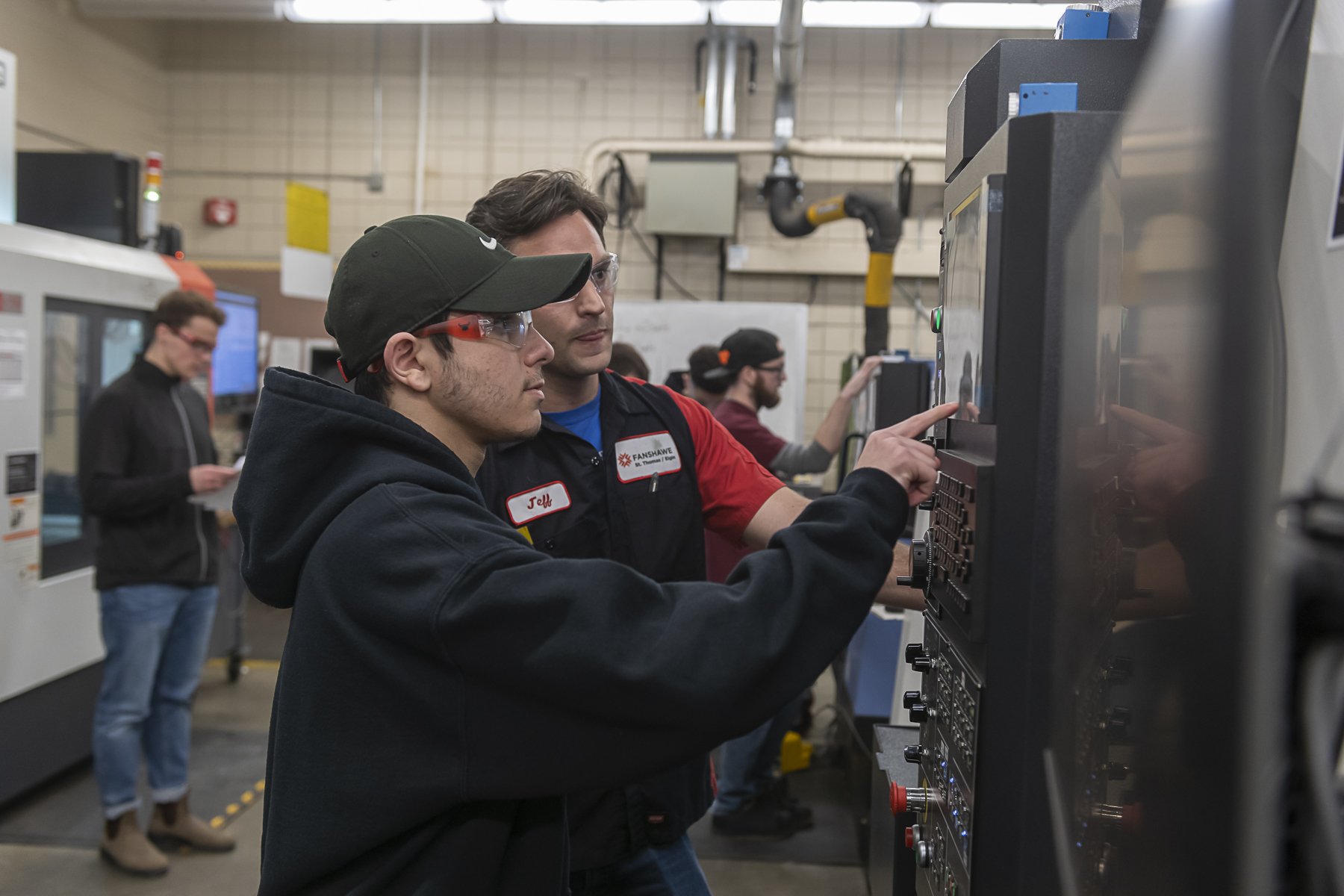 A student working with a CNC Machine