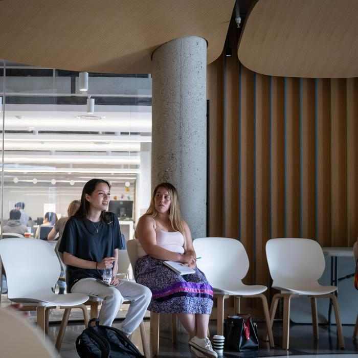 Kalihwíy̲o̲ Circle two students sit side-by-side in the Kalihwíy̲o̲ Circle