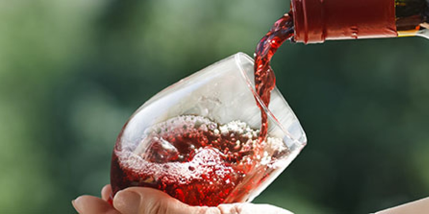Women pours wine