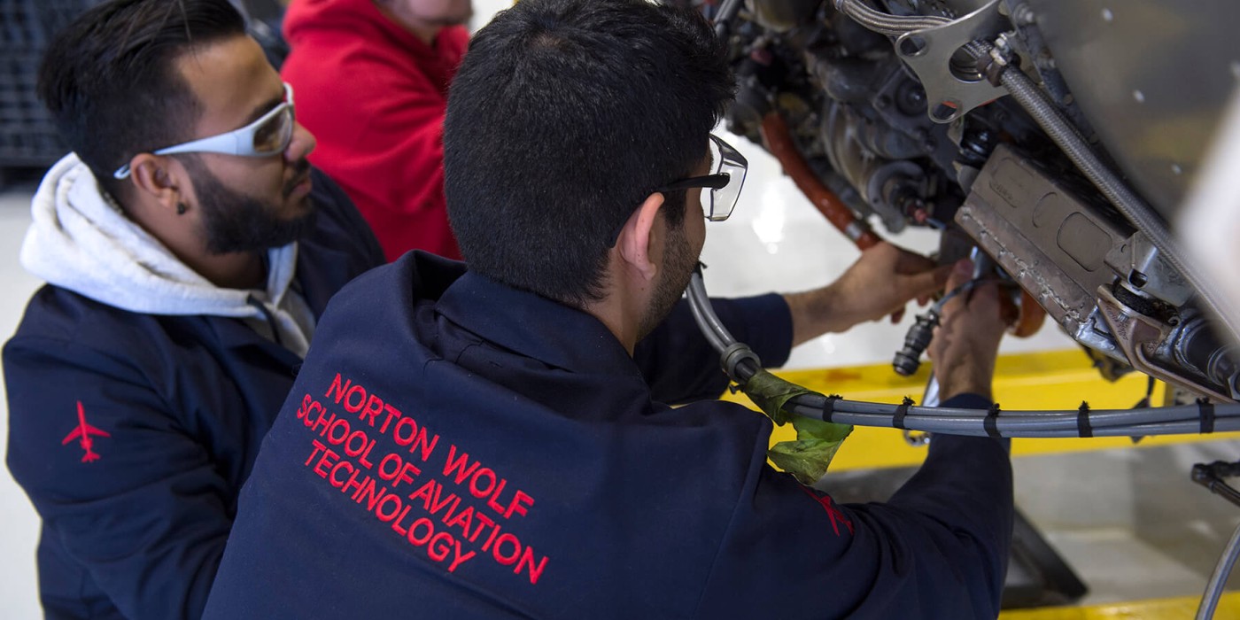 aviation technicians working on an airplane