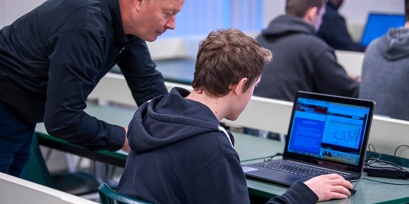 Faculty member helping student