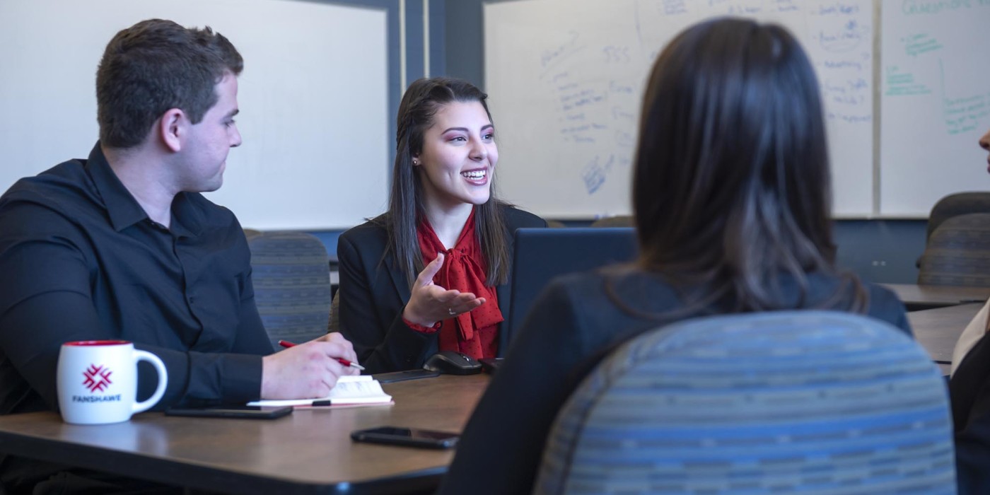 Fanshawe business students, collaborating in conference room