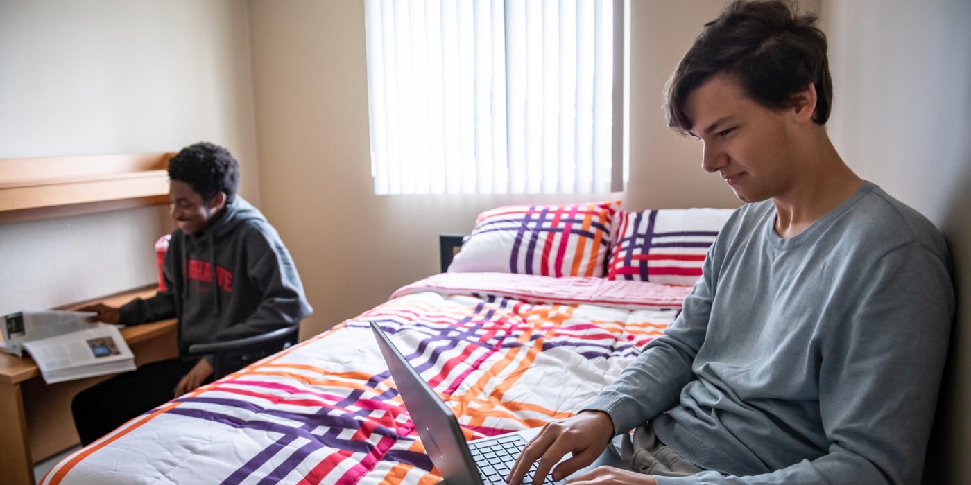 Two guys hanging out in residence room