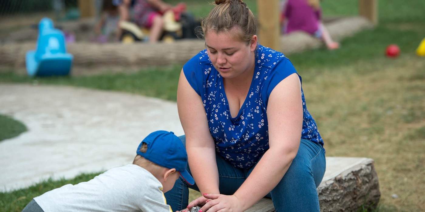 ECE worker playing with children