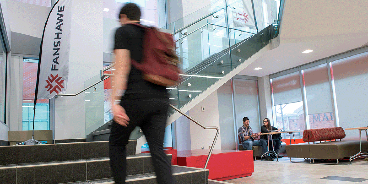 Student walking up stairs