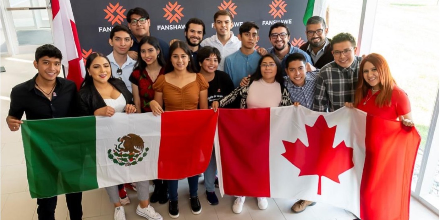 Students from Mexico holding up Mexico and Canada Flag