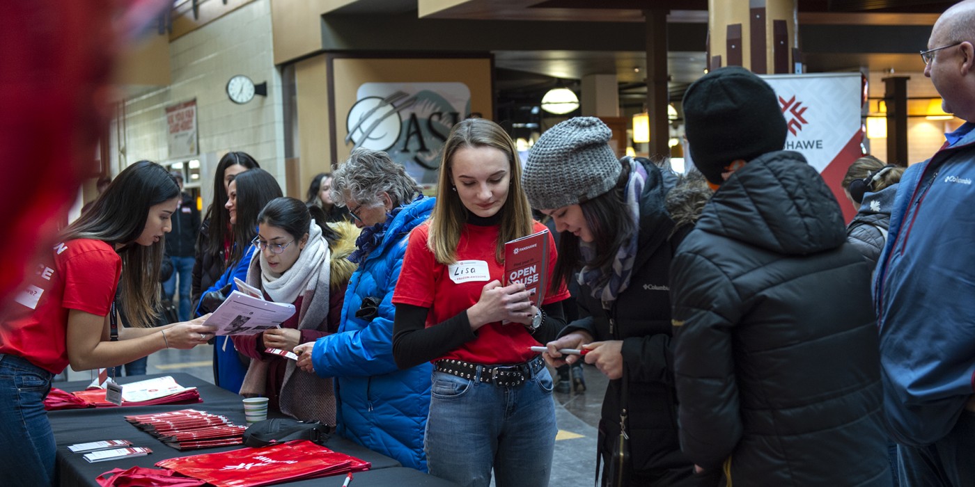 Fanshawe open house with student reviewing fanshawe residence