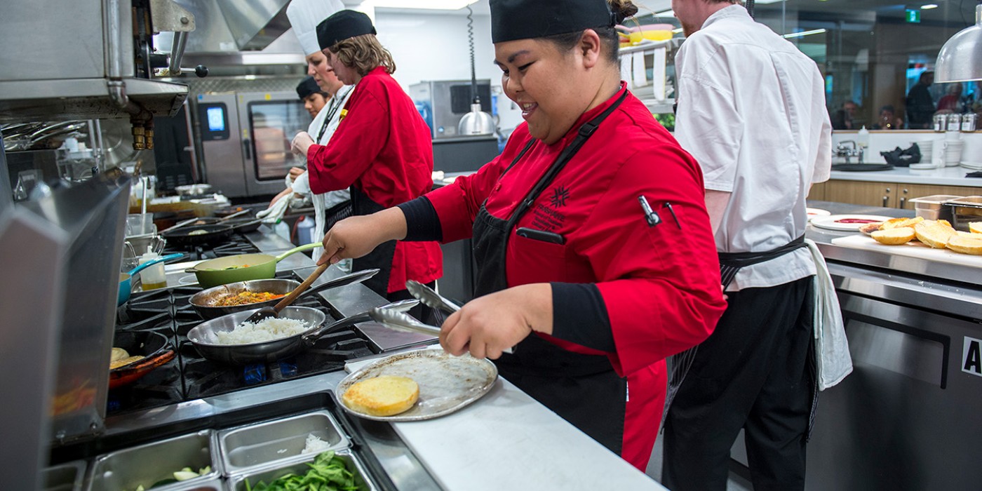 Photo of a culinary student working in the kitchen