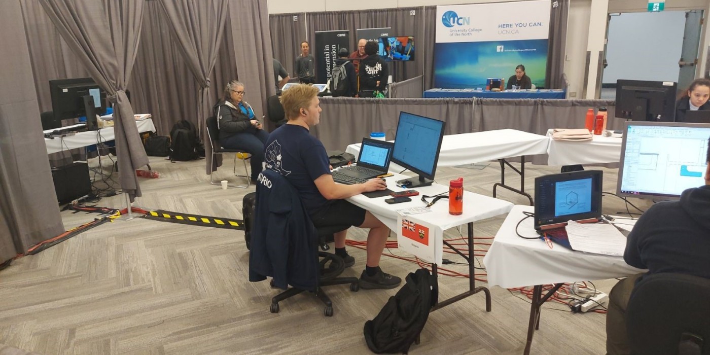 Student sits at a desk competition in the Skills Canada architectural design competition