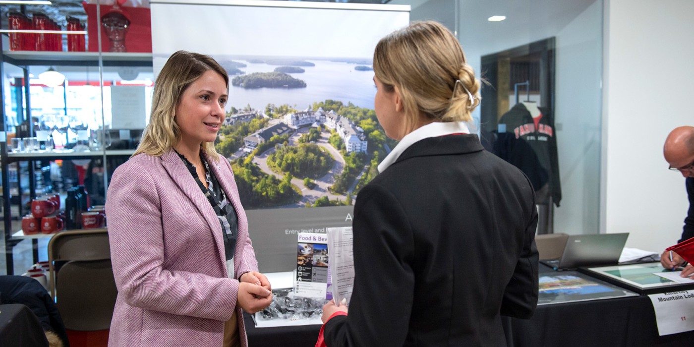 Photo of a Fanshawe student speaking with an employer