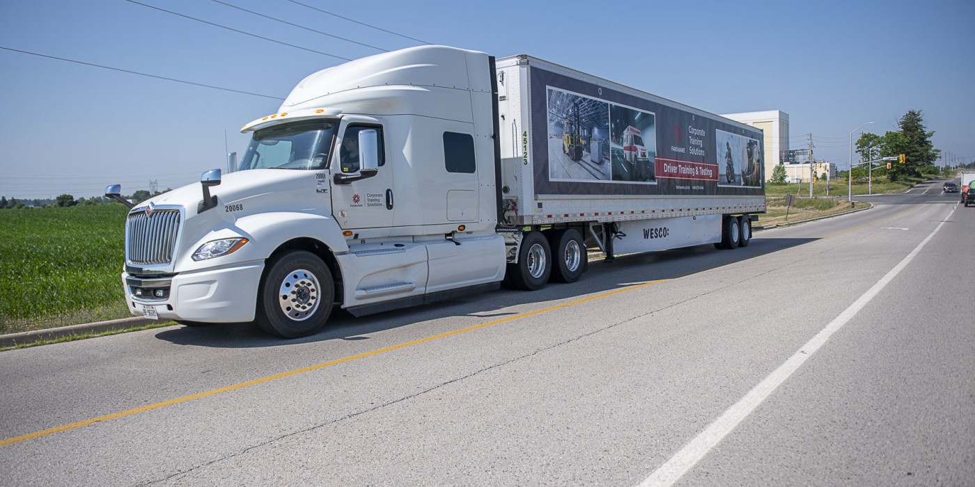 Transport driving down a road