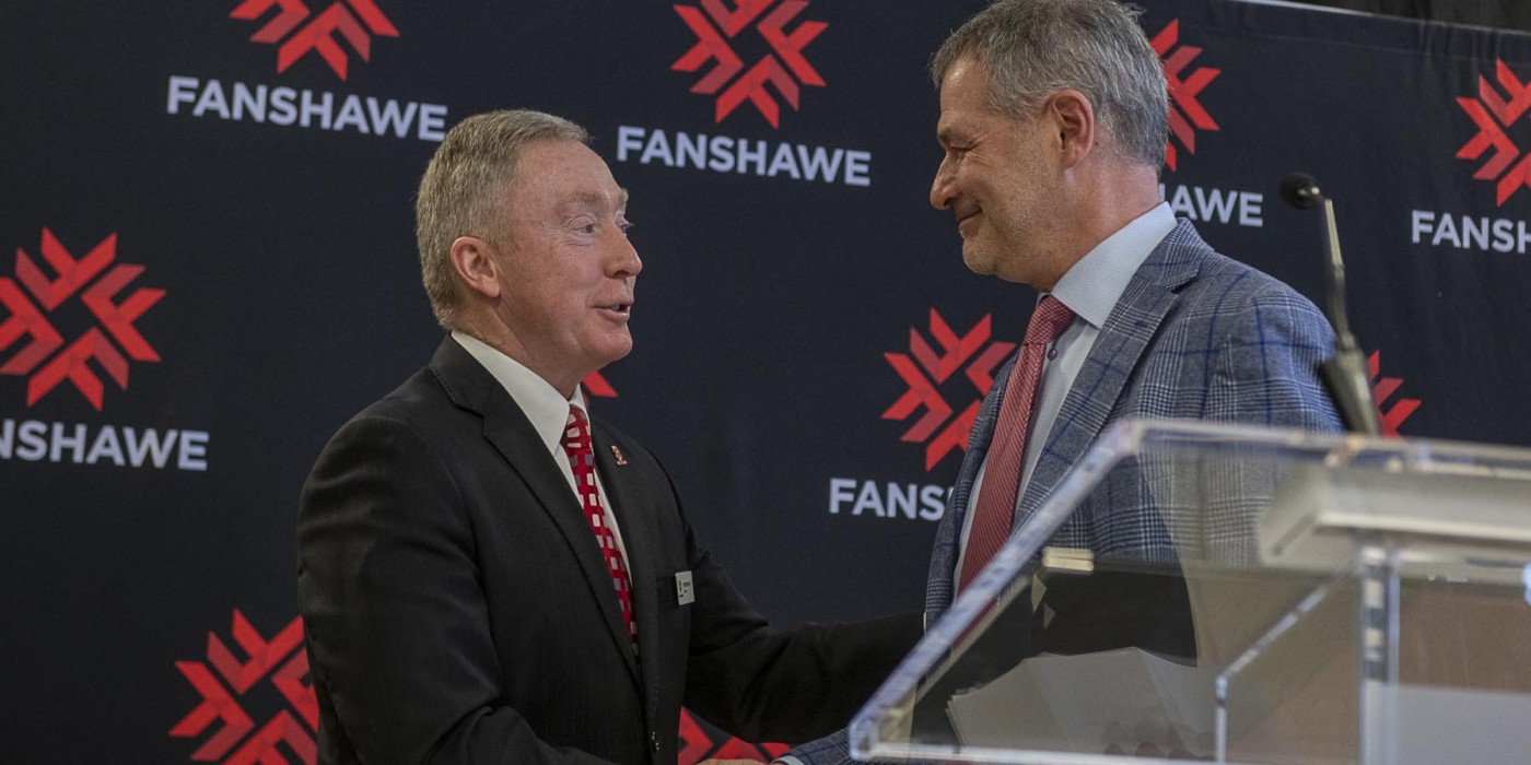 Photo of President Devin shaking hands with Jamie Crich