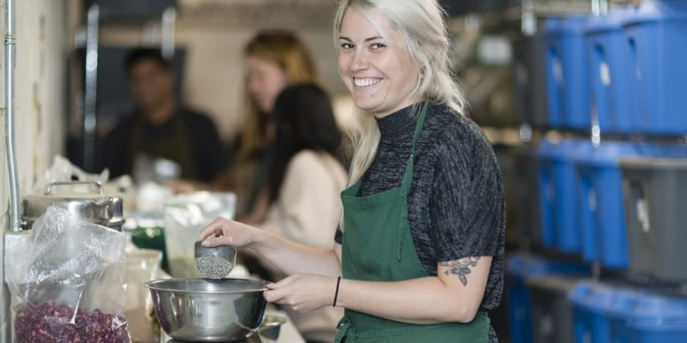Photo of a Perfect Herbs staff member making product