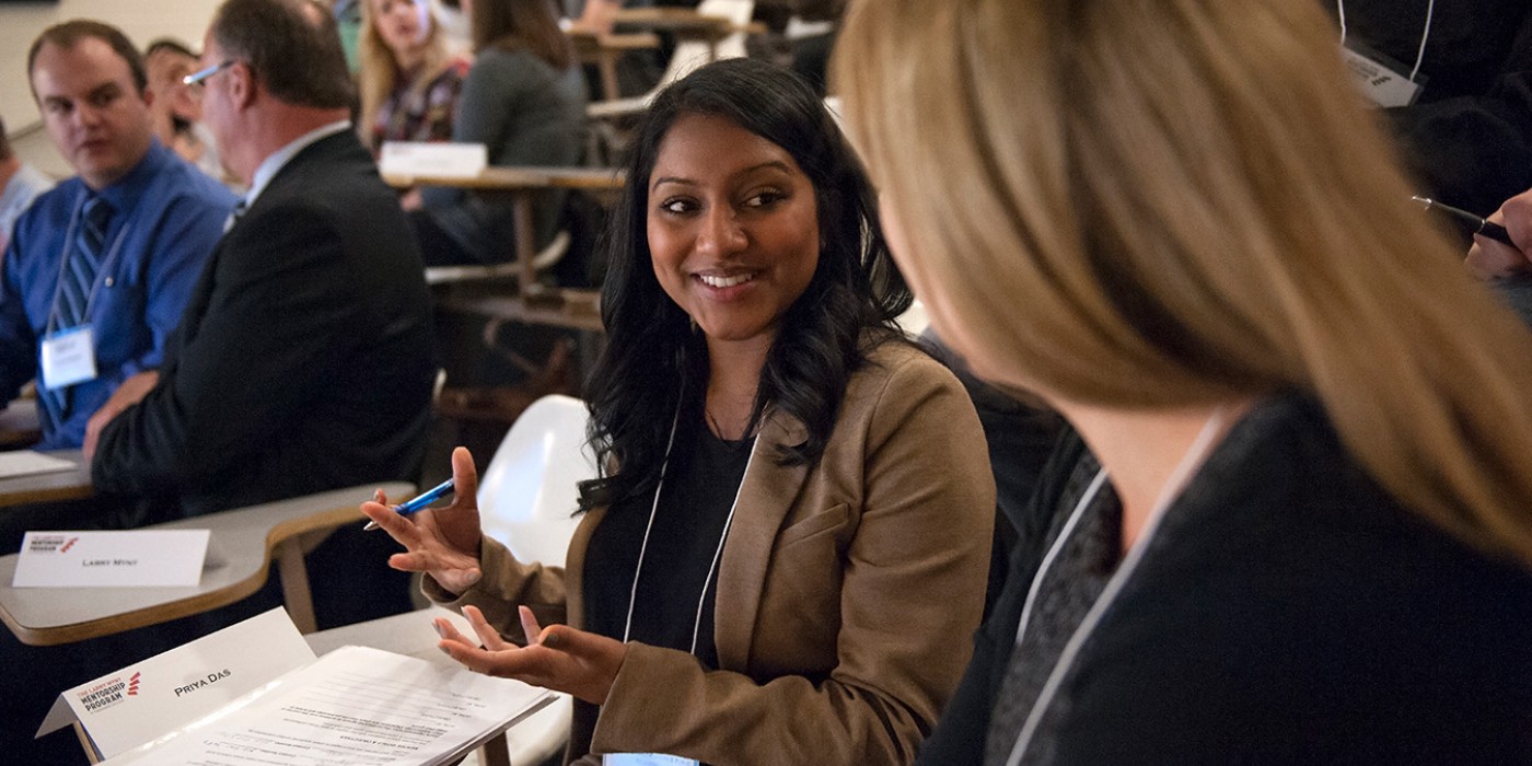 Photo of a student speaking with a mentor at the mentorship fair