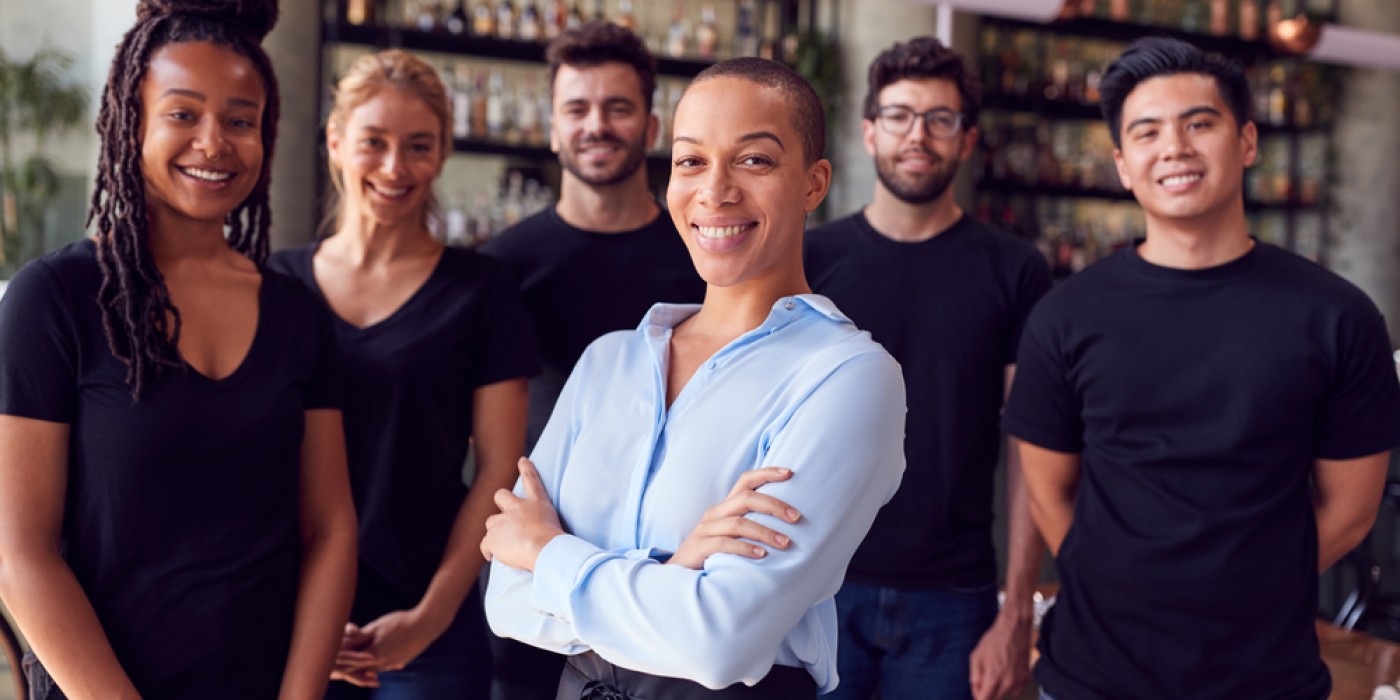 Photo of a bar manager and their staff