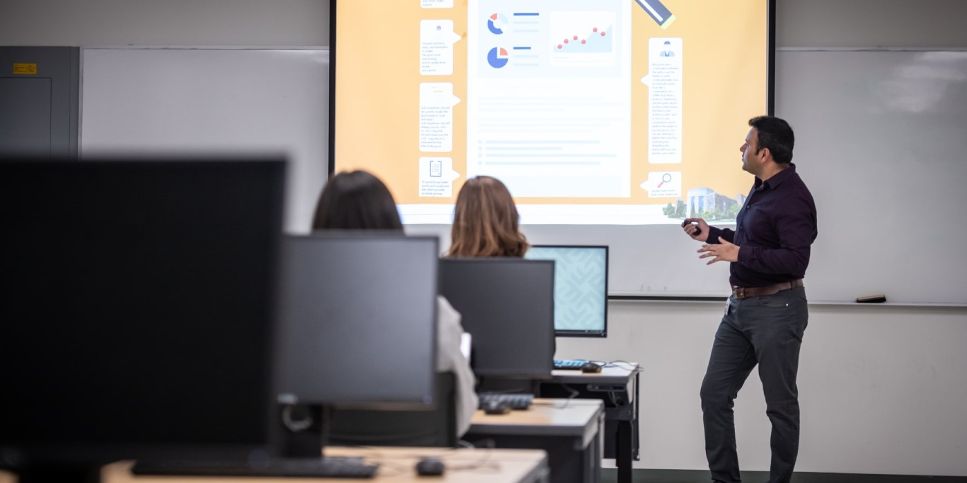 professor uses projector to teach class