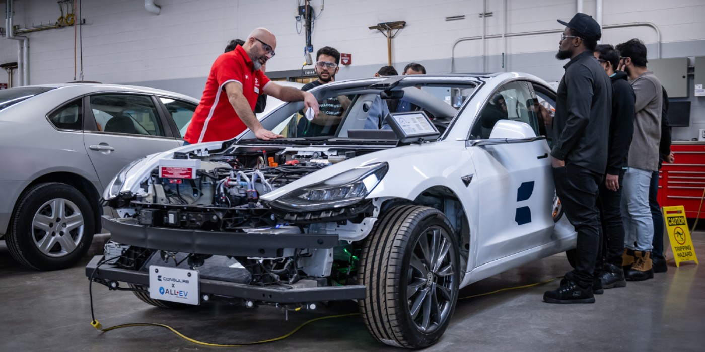 Fanshawe instructor teaching students about the components of an electric vehicle