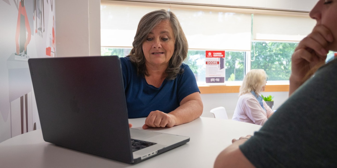 woman in co-op advisory meeting on laptop