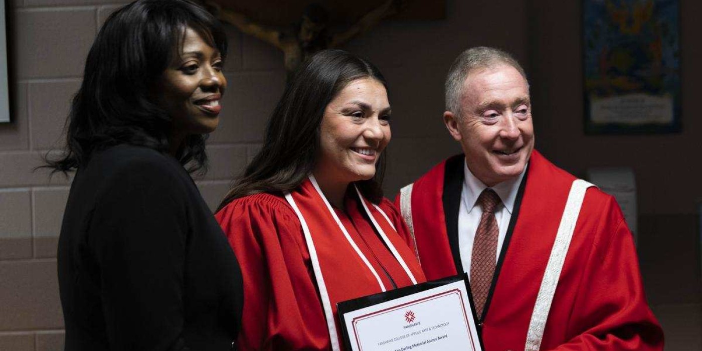 president peter devlin presents award to student