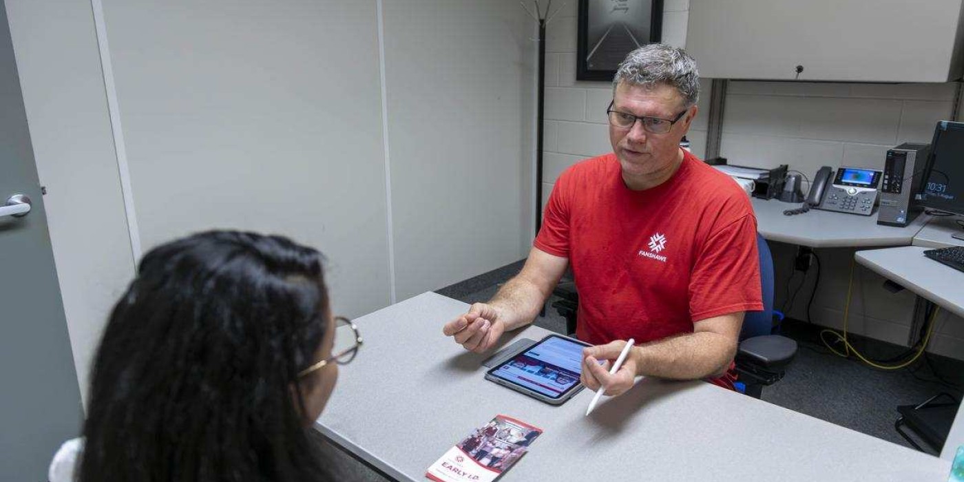 fanshawe counsellor talks to student